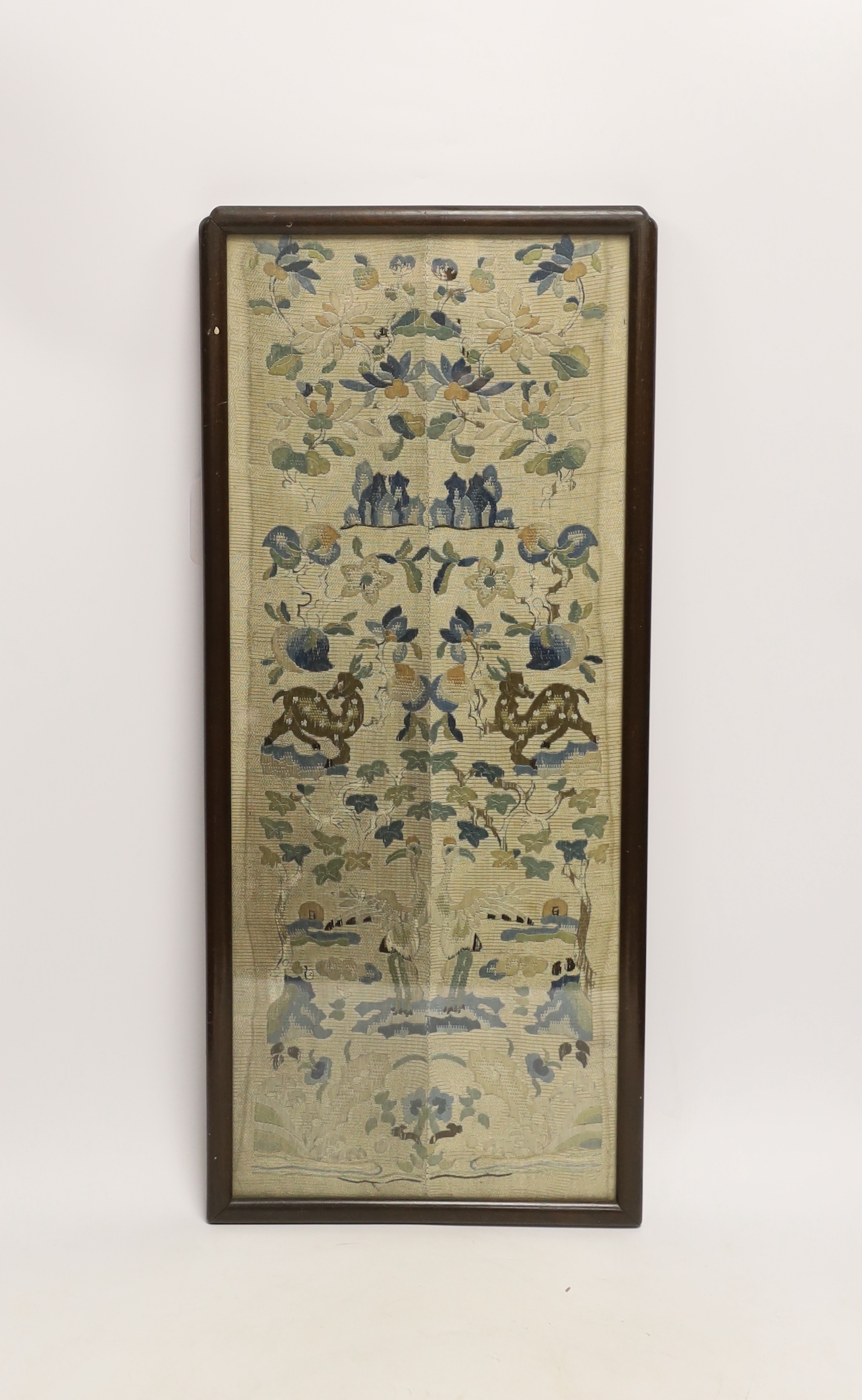 A framed pair of Chinese floral silk embroidered sleeve bands, embroidered with Chinese knot and stem stitch, 19cm wide x 50cm high